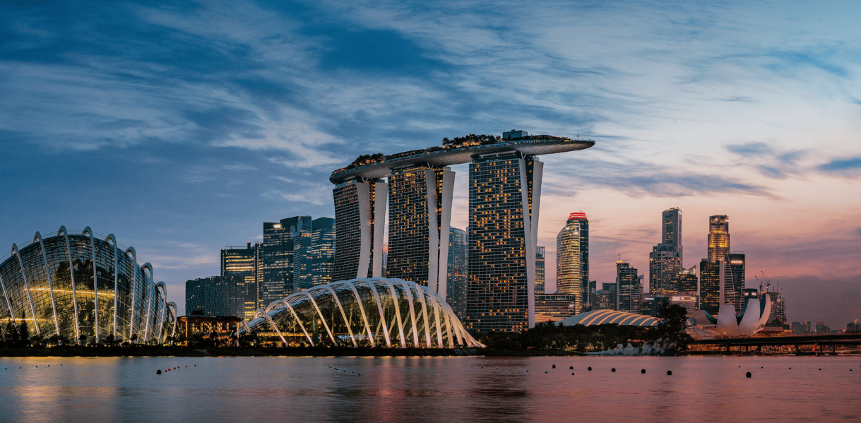 Singapore’s Marina Bay skyline at twilight with illuminated domes and skyscrapers